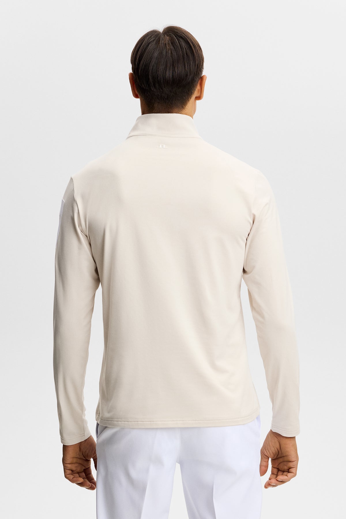 Couche intermédiaire J.Lindeberg Keaton Quarter Zip Moonbeam – détail de l'imprimé manche en caoutchouc et du demi-zip