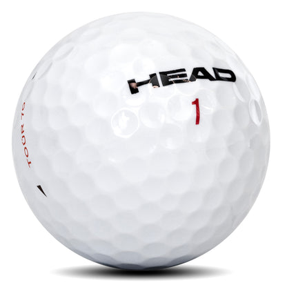 Gros plan sur la balle de golf HEAD TOUR 70 montrant l'enveloppe en uréthane et le motif d'alvéoles
