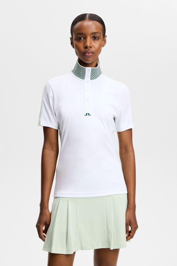 Polo J.Lindeberg Pip Blanc – vue de face montrant le col jacquard et la patte de boutonnage